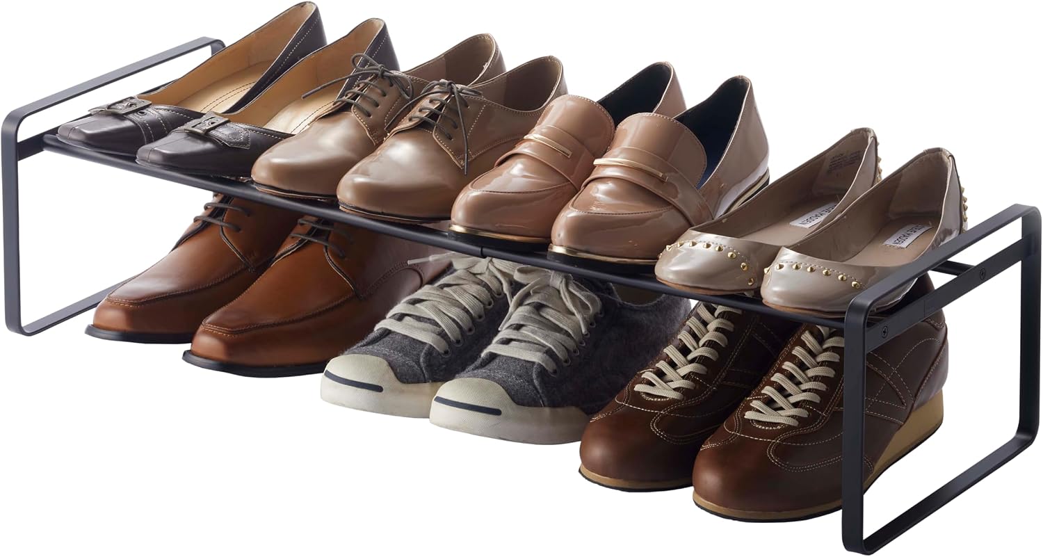 One low black Yamazaki Frame adjustable shoe rack; the shoes underneath rest on the floor and shoes are not included